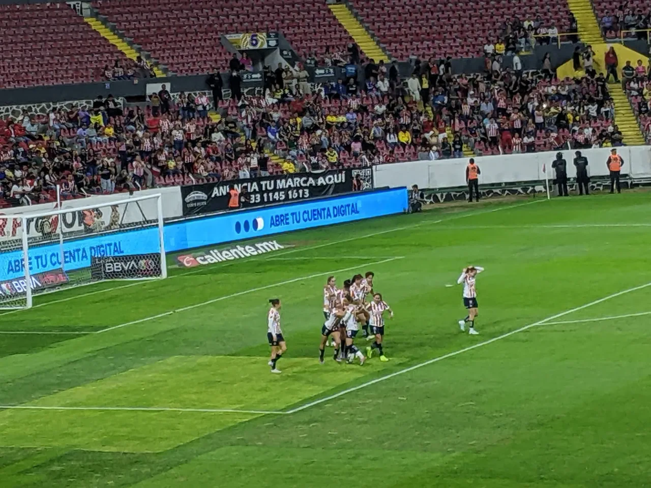 Chivas Femenil players celebrate a goal at Estadio Jalisco