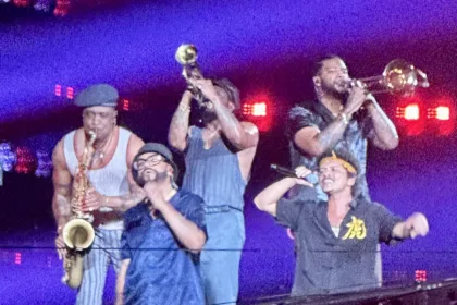 Bruno Mars and musicians from his band at a concert in Singapore