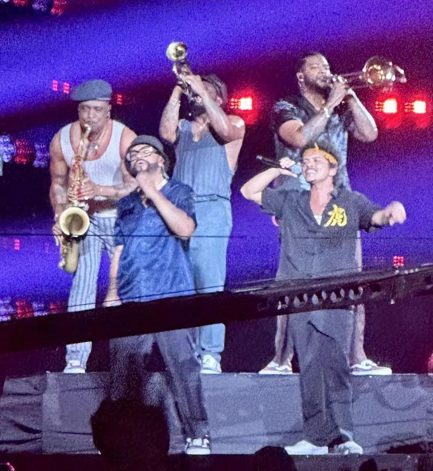 Bruno Mars and musicians from his band at a concert in Singapore