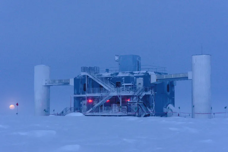 IceCube Laboratory at the South Pole at twilight, with the Moon near the horizon
