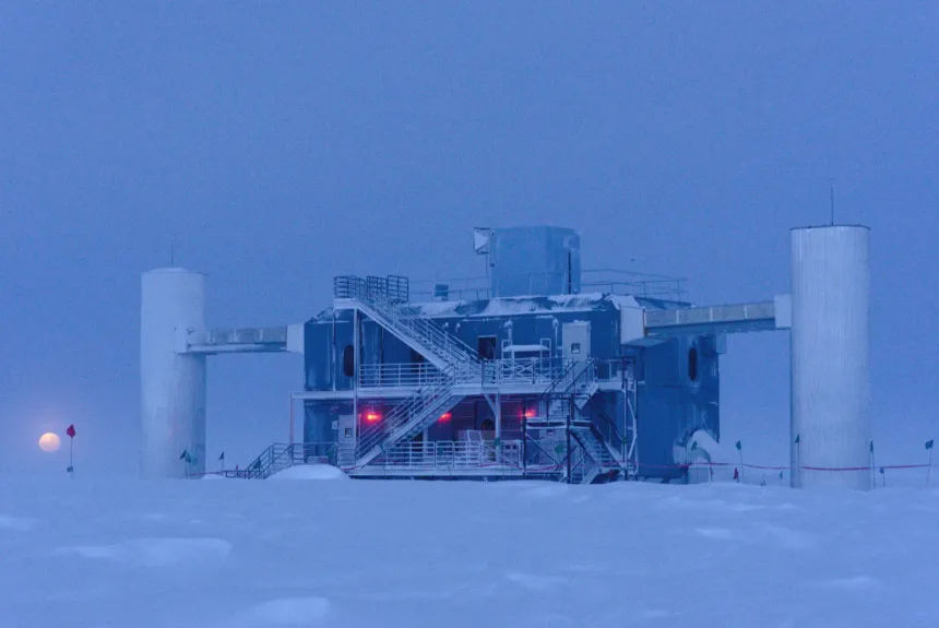 IceCube Laboratory at the South Pole at twilight, with the Moon near the horizon