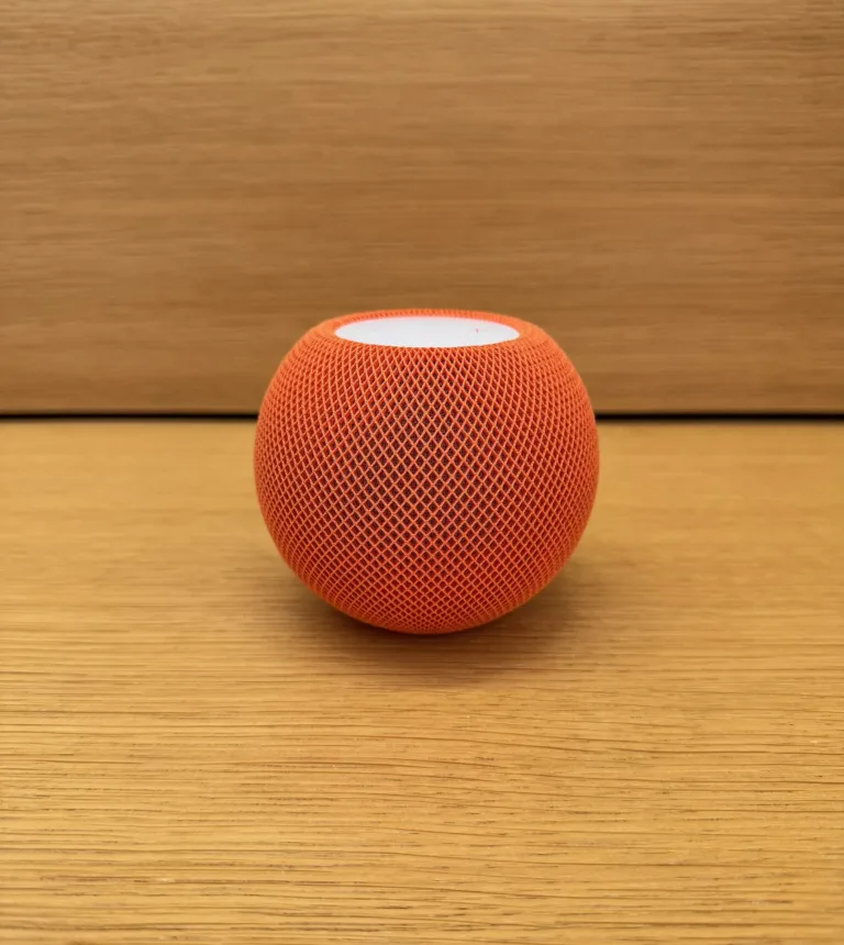 HomePod mini on a wooden surface, archival photograph