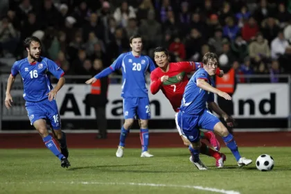 Archive photo from 12 in October 2010: Cristiano Ronaldo, wearing Portugal’s red jersey, battles for the ball with Iceland players during a match.