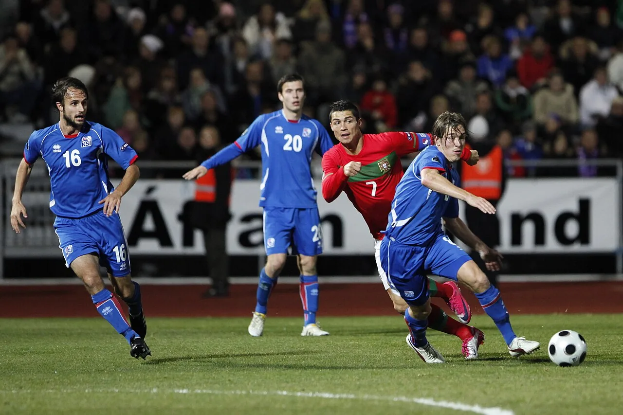 Archive photo from 12 in October 2010: Cristiano Ronaldo, wearing Portugal’s red jersey, battles for the ball with Iceland players during a match.