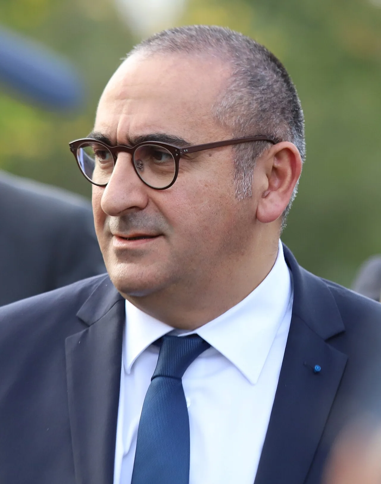File photo of Laurent Nuñez, in the foreground wearing glasses and a suit, taken in October 27, 2019.