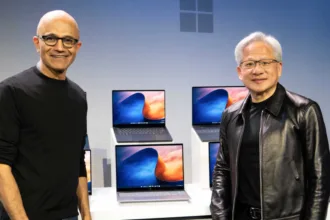 Satya Nadella and Jensen Huang alongside laptops during the RTX Spark announcement