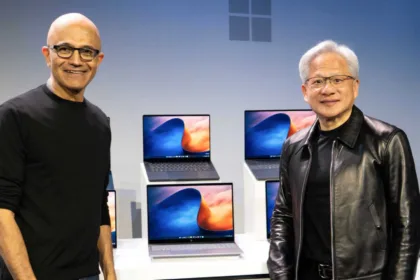 Satya Nadella and Jensen Huang alongside laptops during the RTX Spark announcement