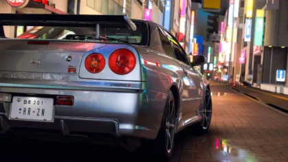 Nissan Skyline GT-R on a brightly lit street in Tokyo, official Forza Horizon 6 capture